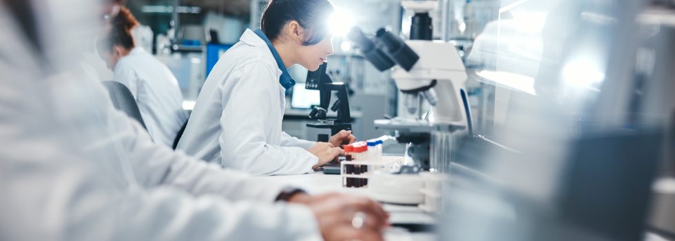 Medical, research and scientist in laboratory with microscope, observation and experiment for study.
